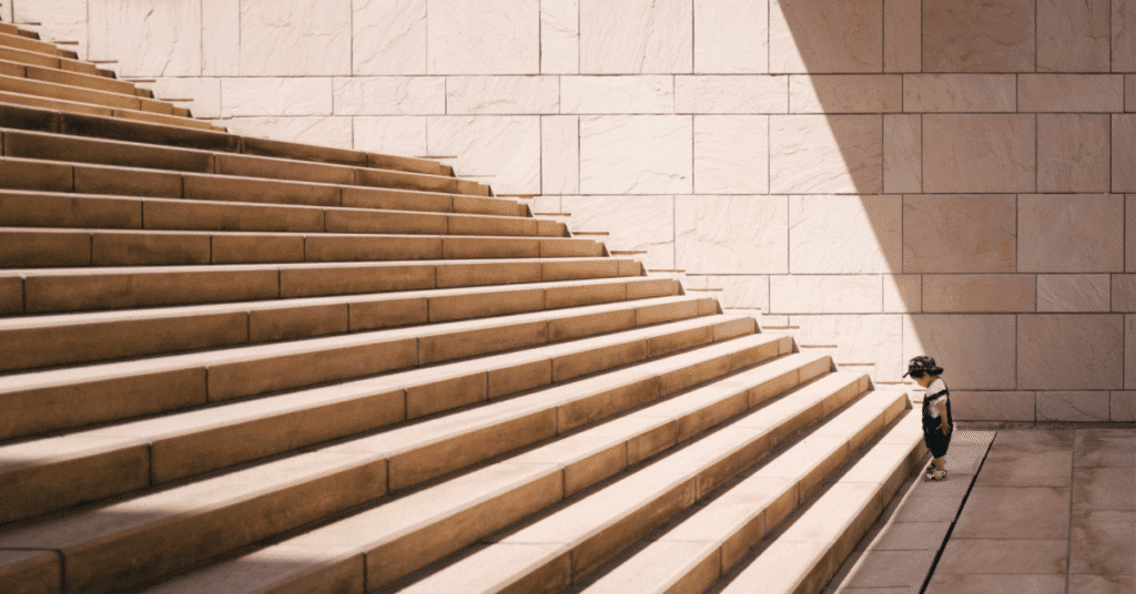 Lots of Stairs with Kid Looking up Them